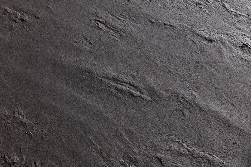 Close-up of dark charcoal concrete wall texture