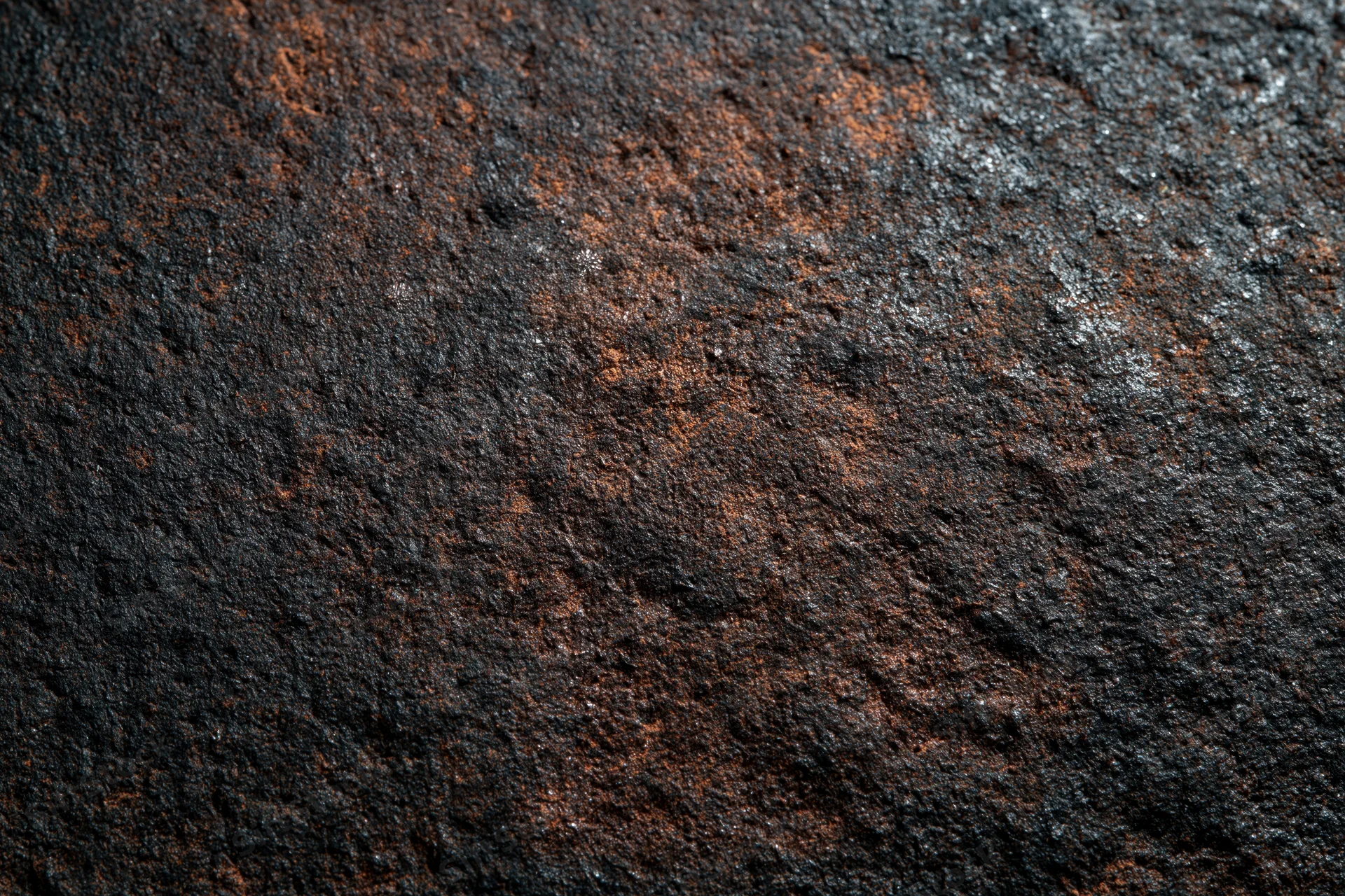 Close-up of a heavily oxidized metal surface with rust and corrosion patterns