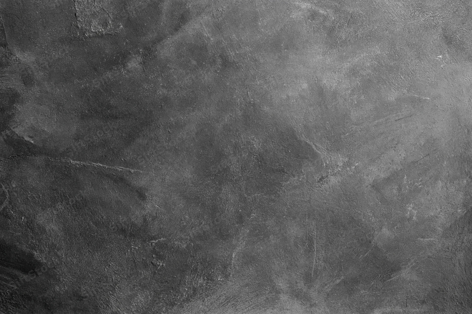 Close-up of rough concrete wall surface with visible texture and cracks