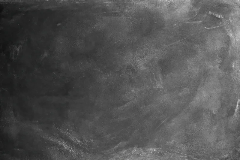 Close-up of rough gray concrete wall surface with textured grunge pattern