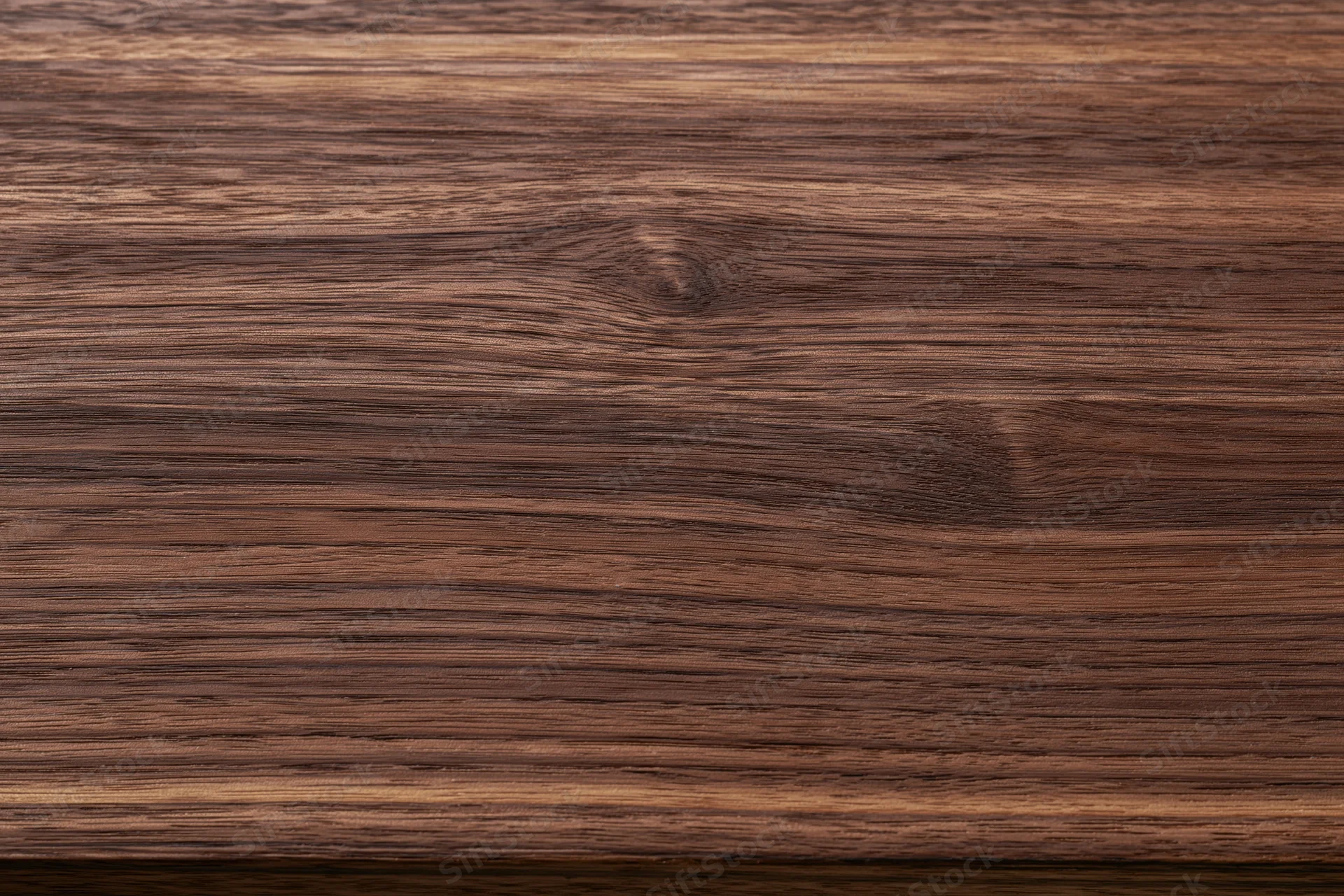 Close-up of dark walnut wood grain surface filling the frame