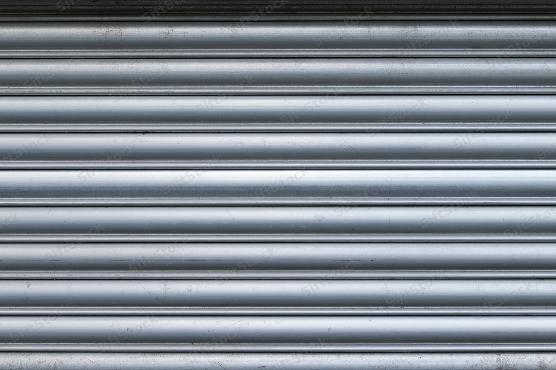 Close-up of a corrugated metal roller shutter door on a building exterior