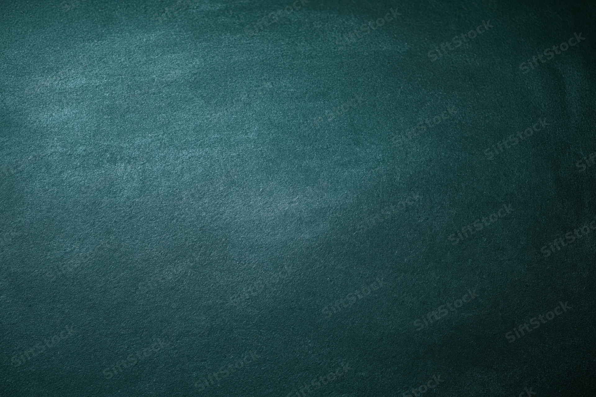 Dark green chalkboard surface filling the frame