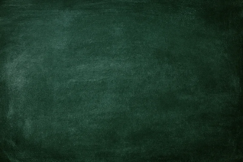 Dark green chalkboard surface filling the frame with faint smudges and texture
