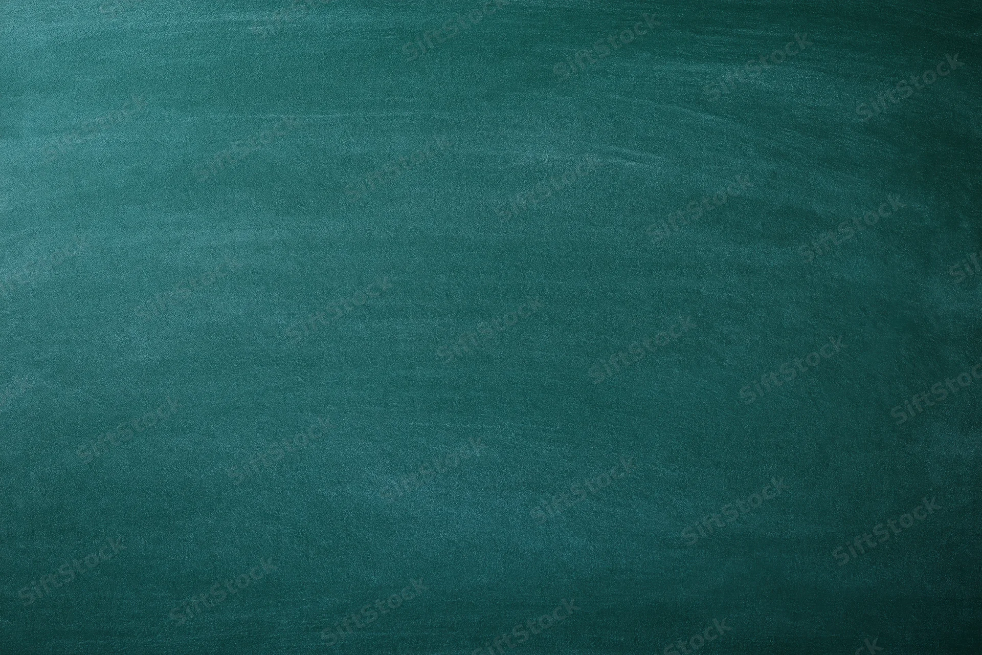 Empty green chalkboard surface filling the frame
