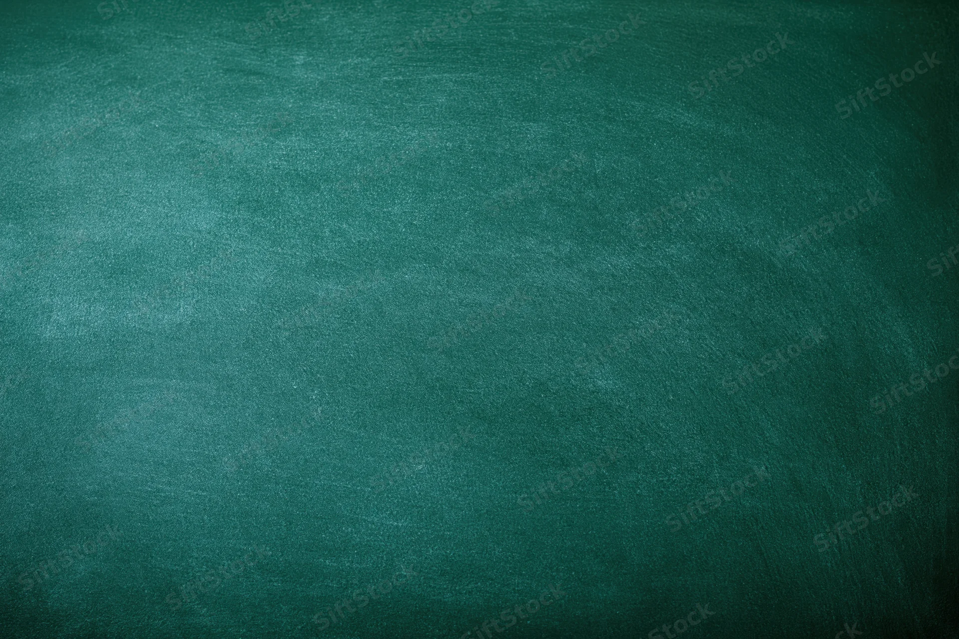 Empty green chalkboard surface filling the frame
