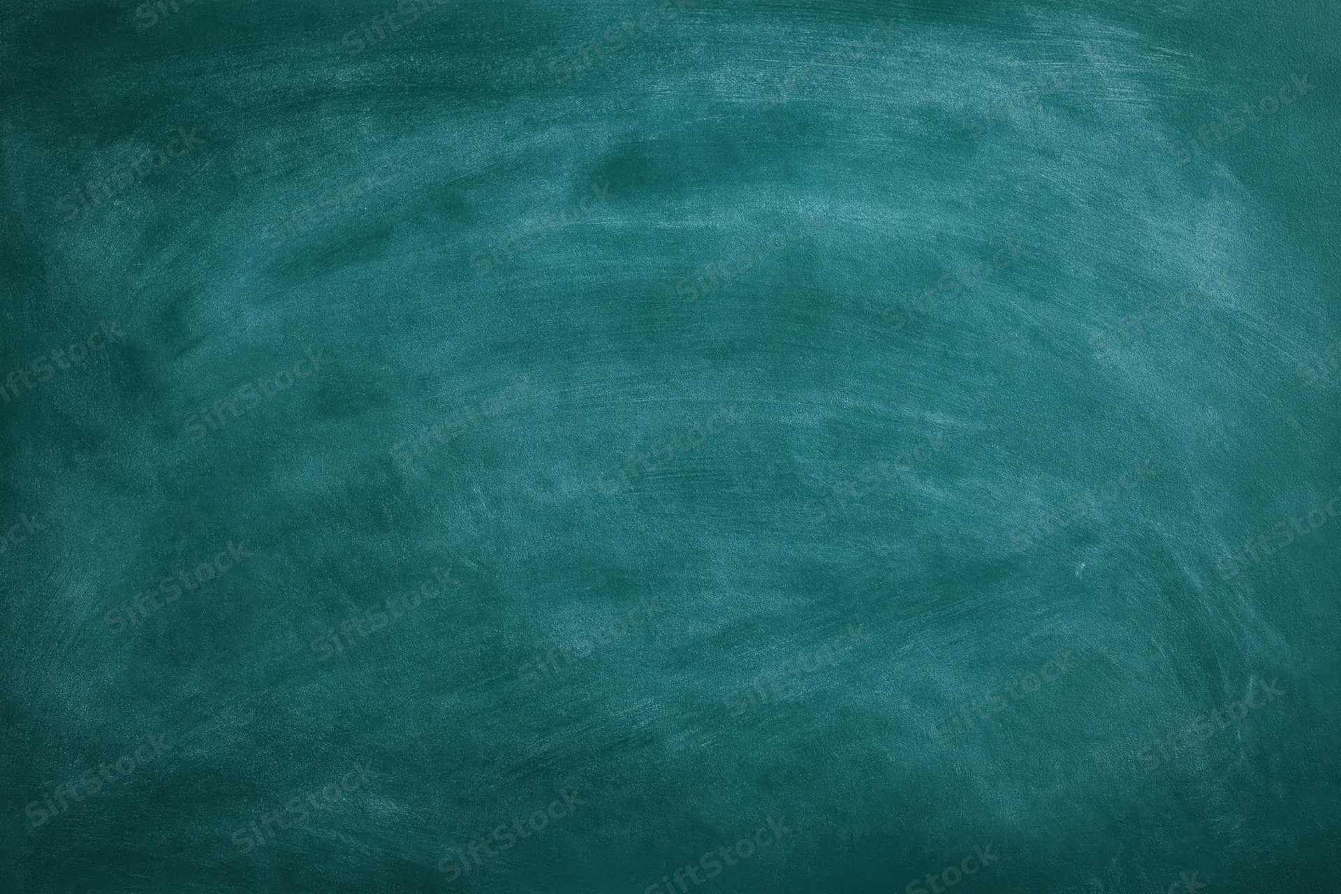 Empty green chalkboard surface filling the frame