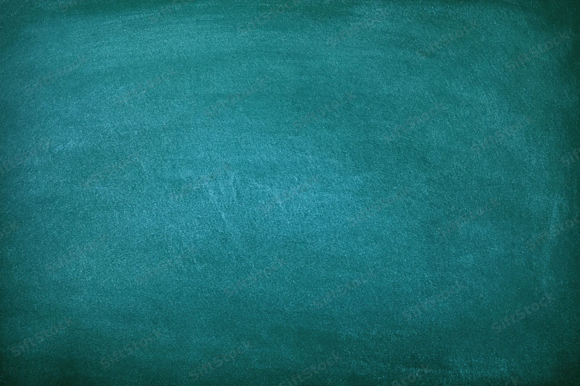 Empty green chalkboard surface filling the frame