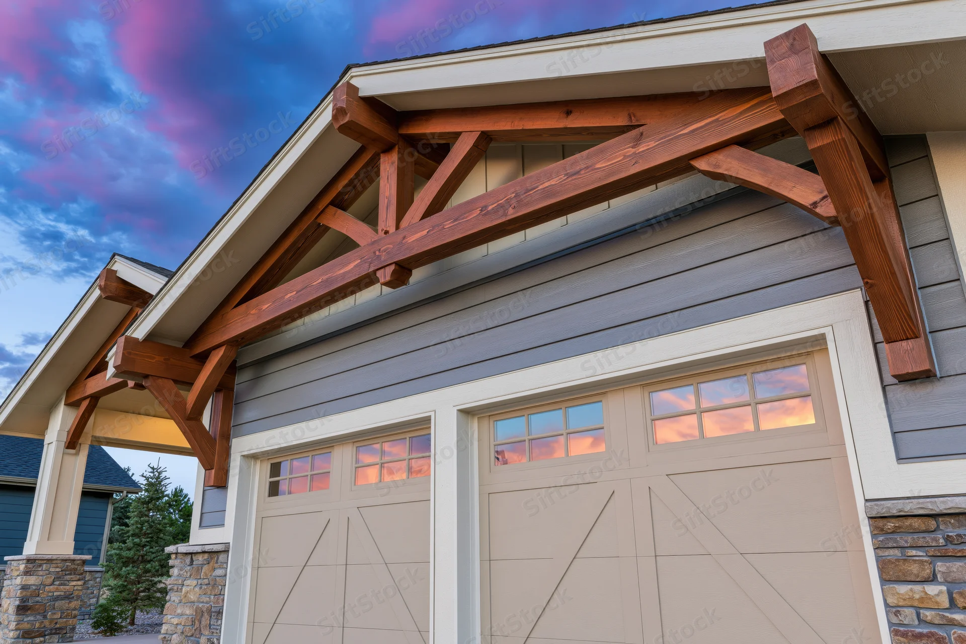 Craftsman-style house exterior with wooden beams and garage doors under twilight sky