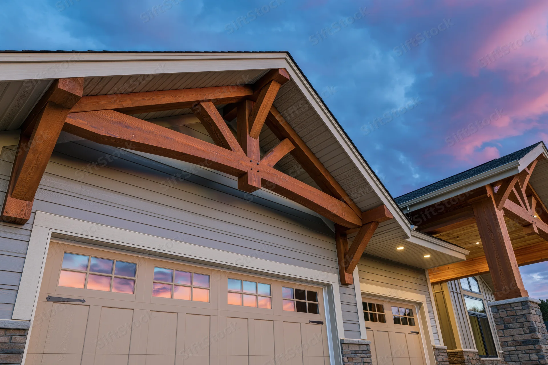Craftsman-style home exterior with wooden beams over garage and covered entryway at dusk