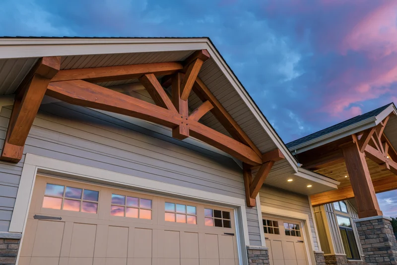 Craftsman-style home exterior with wooden beams over garage and covered entryway at dusk