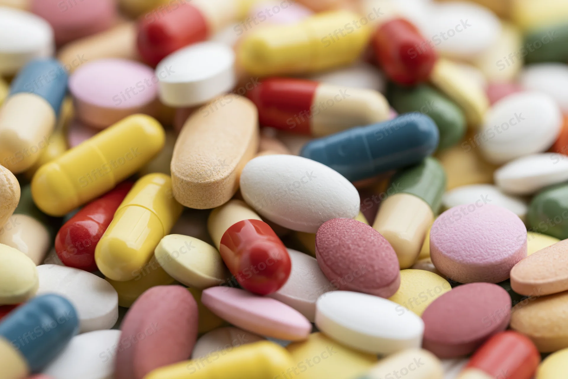 Closeup of assorted colorful pharmaceutical pills and capsules in a pile