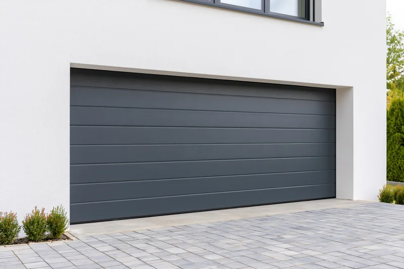 Modern residential garage with horizontal panel door on white exterior wall