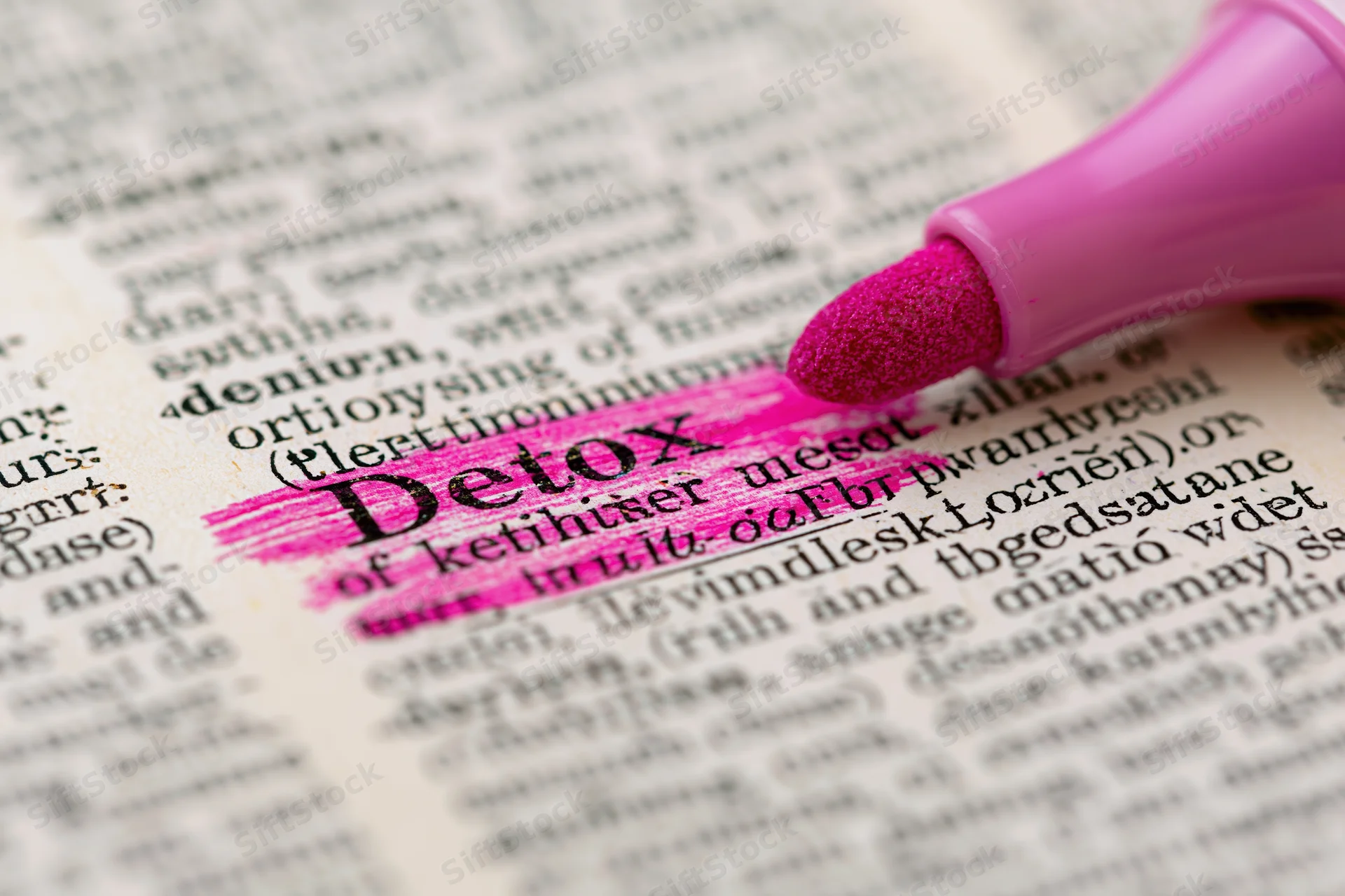 Pink highlighter marking the word detox in a dictionary page