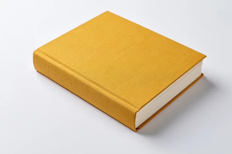 Mustard-yellow hardcover book with cloth cover on white background