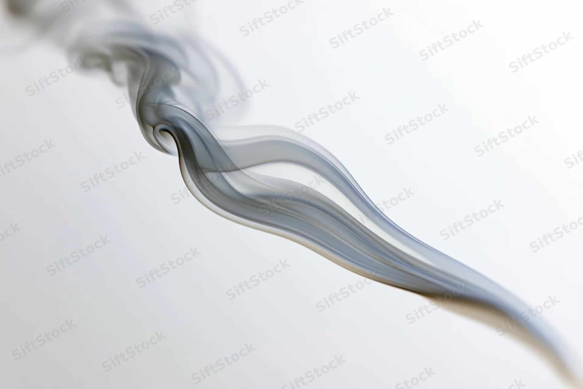 A thin wisp of smoke curling upward against a soft white background