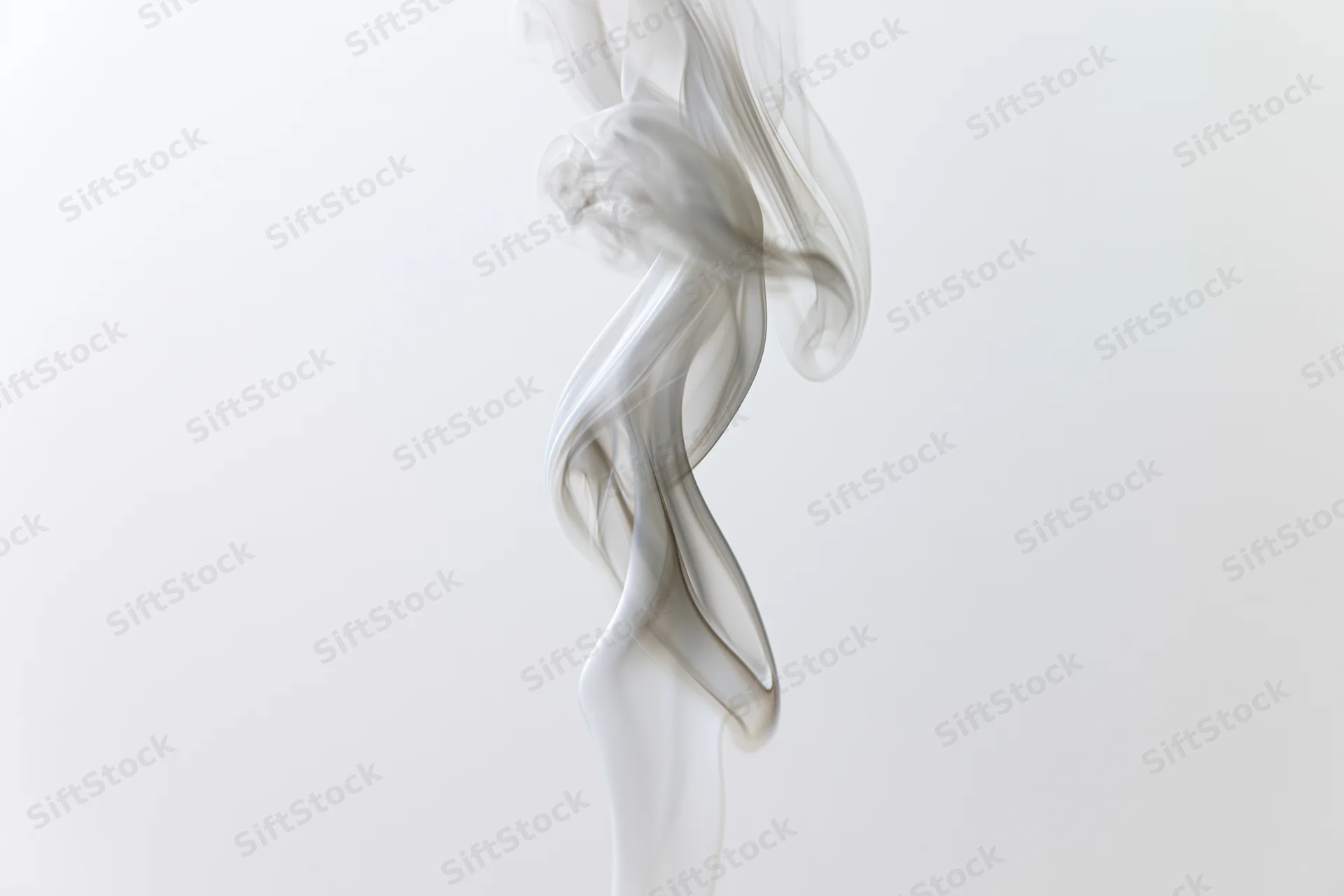 Thin wisp of white smoke curling upward against a plain white background