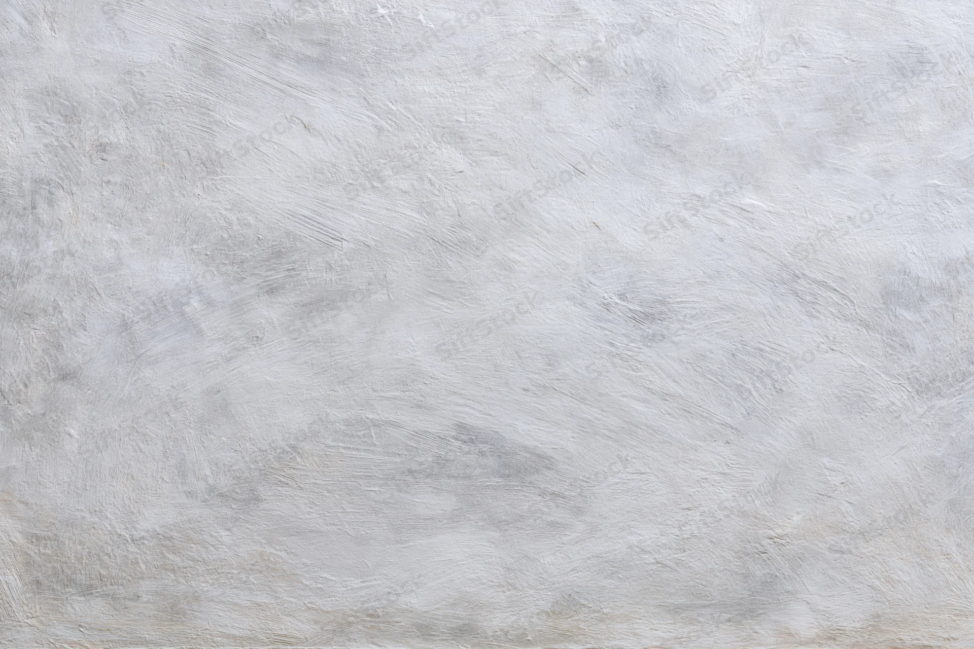 Textured concrete wall surface filling the frame as a neutral background
