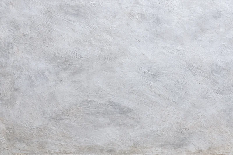 Textured concrete wall surface filling the frame as a neutral background