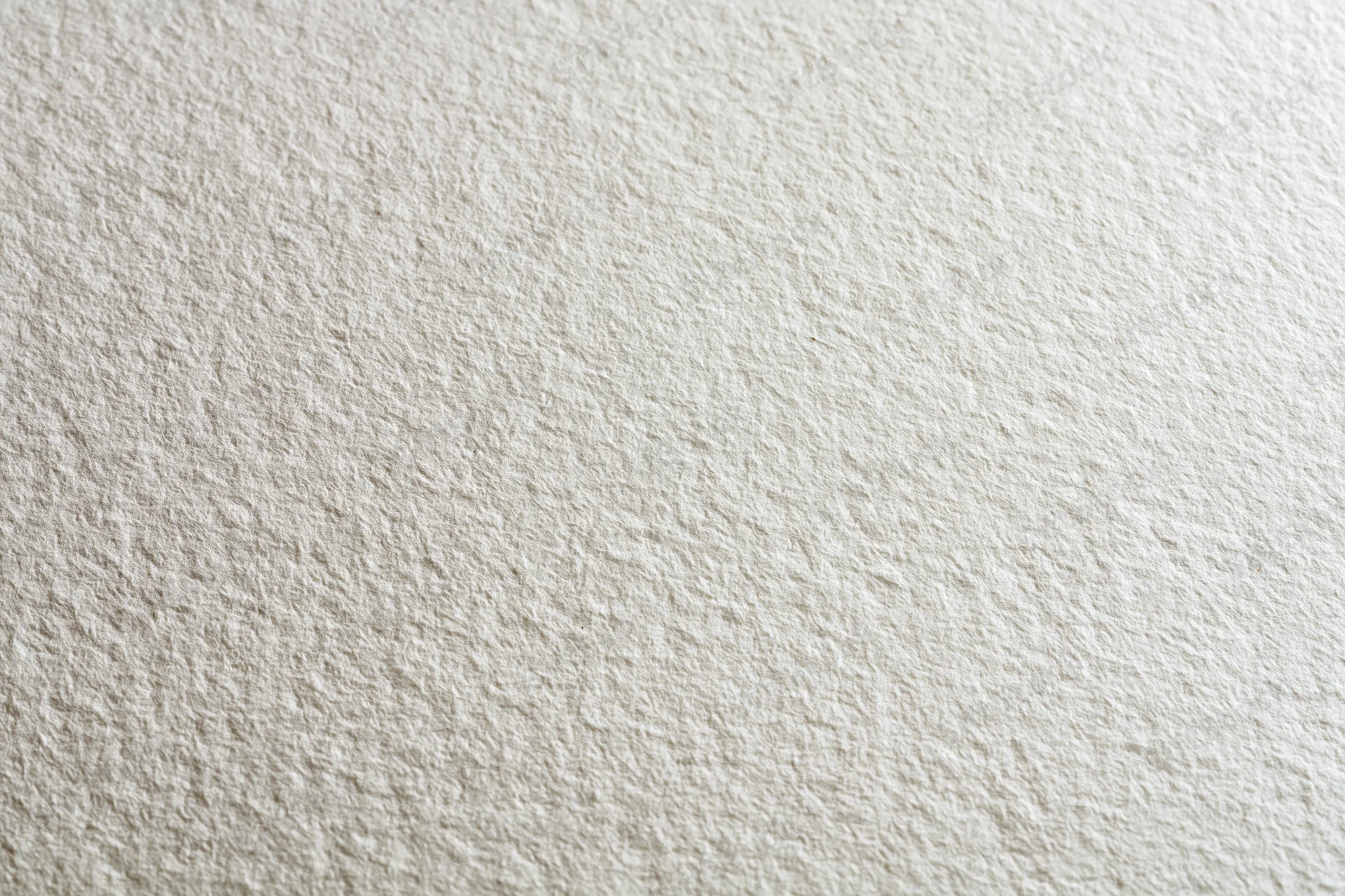 Close-up of textured white paper surface for artistic use