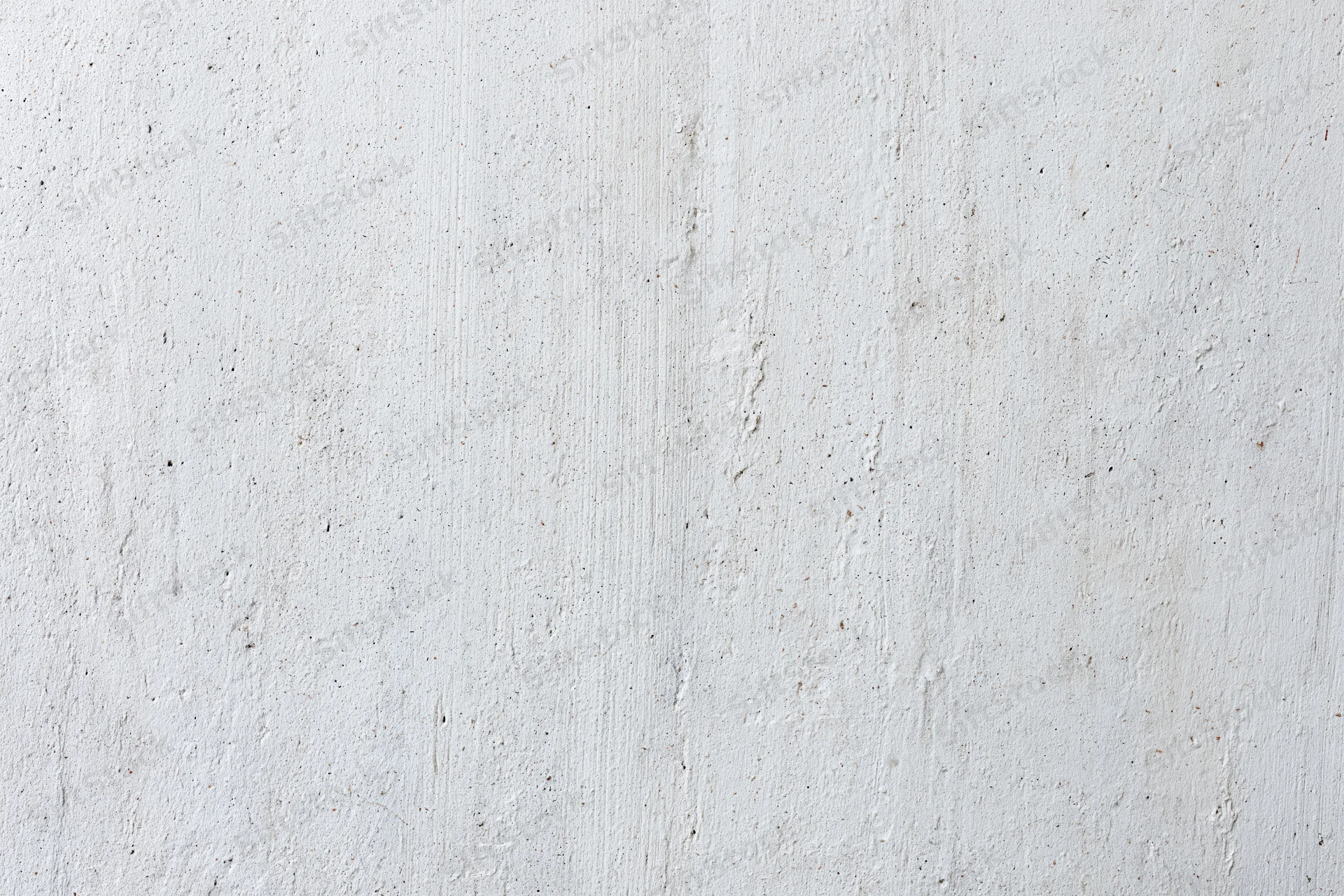 Close-up of a weathered concrete wall surface with visible texture and minor imperfections