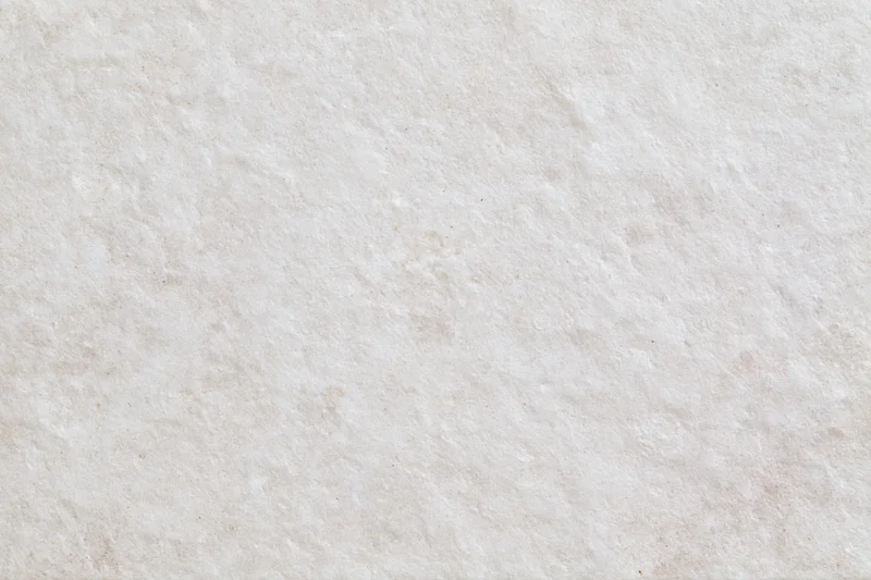 Close-up of smooth limestone or concrete surface with natural texture and veining