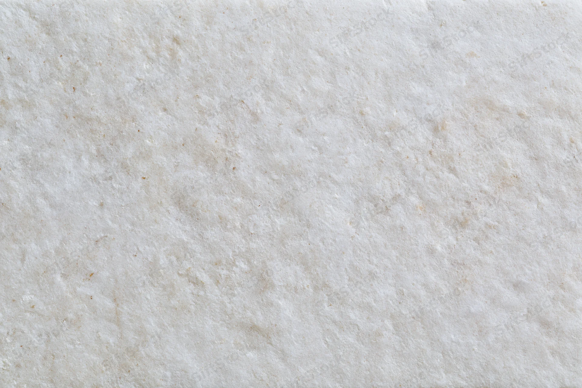 Close-up of smooth limestone or concrete surface with natural veining and neutral tone