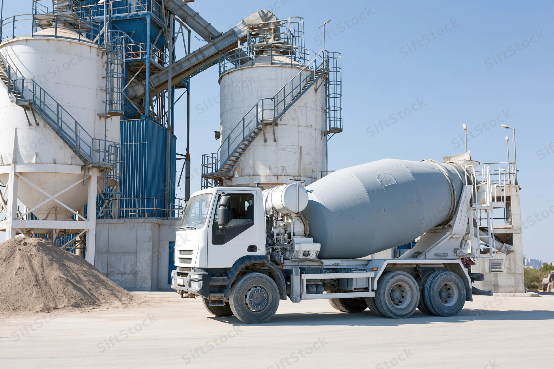 Concrete mixer truck parked at cement batching plant facility
