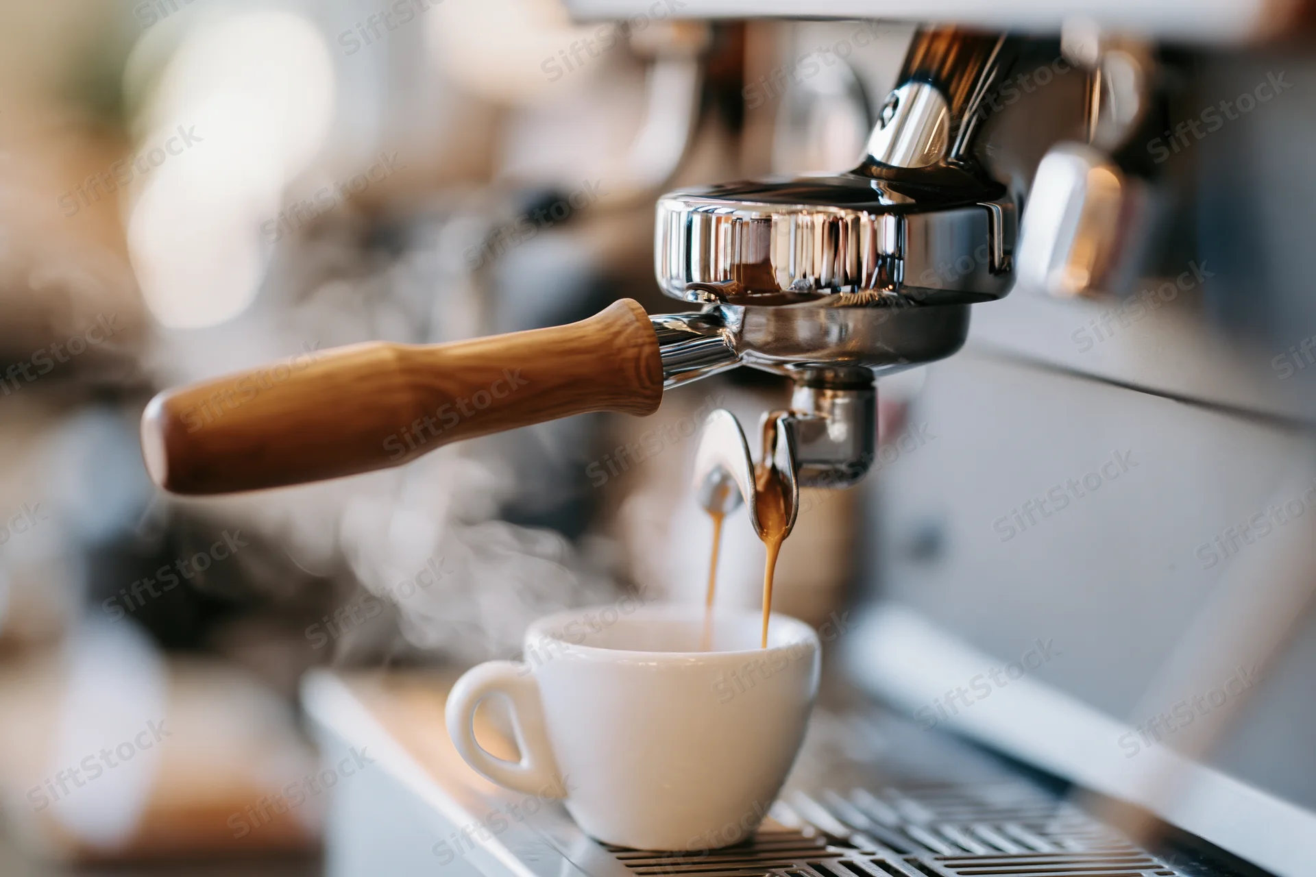 Espresso machine extracting coffee into a white ceramic cup on a cafe counter