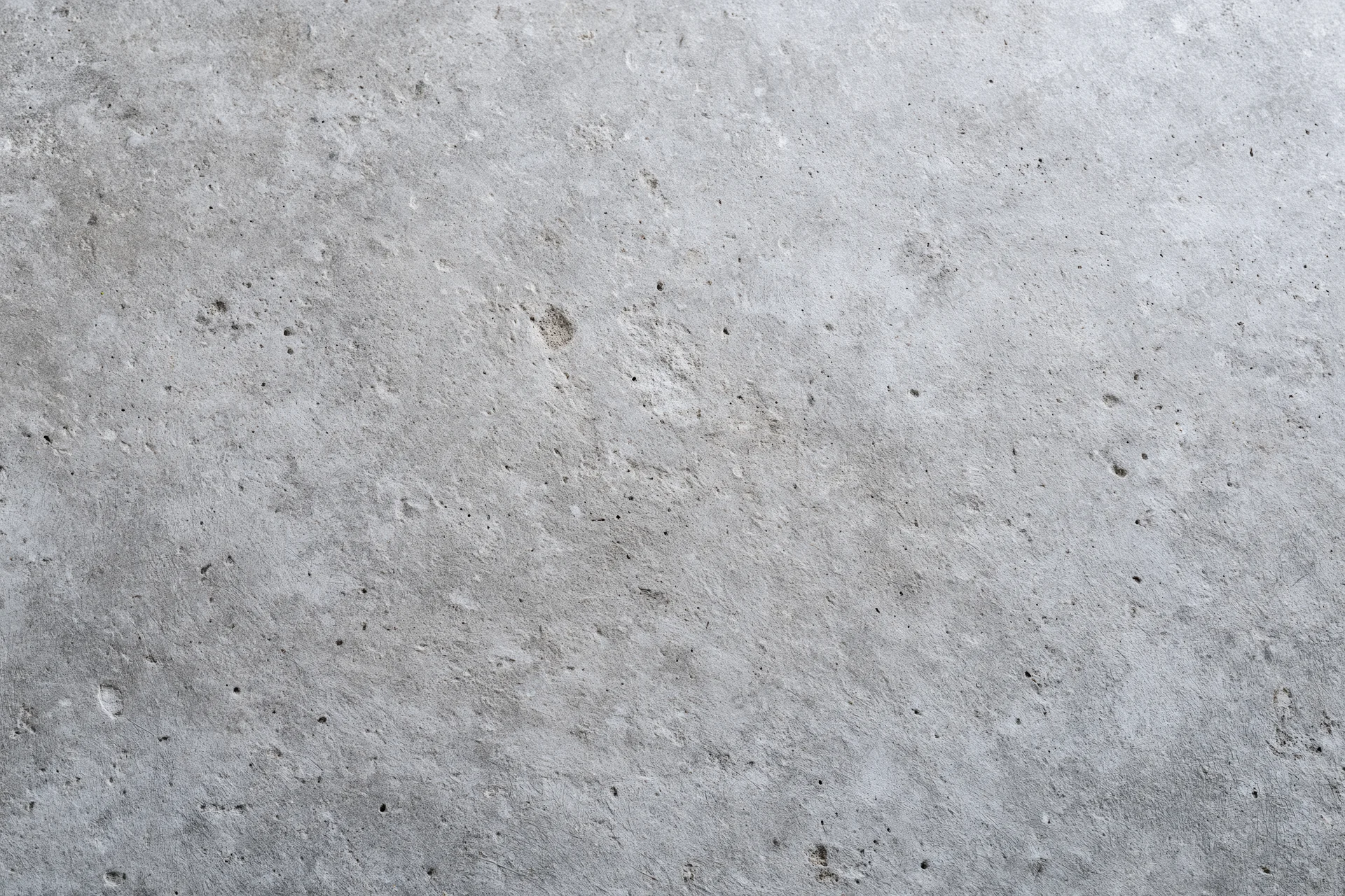 Close-up of a rough gray concrete wall surface filling the frame