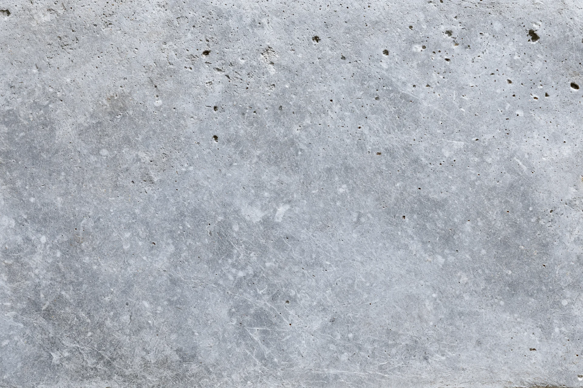 Close-up of a rough gray concrete wall surface filling the frame