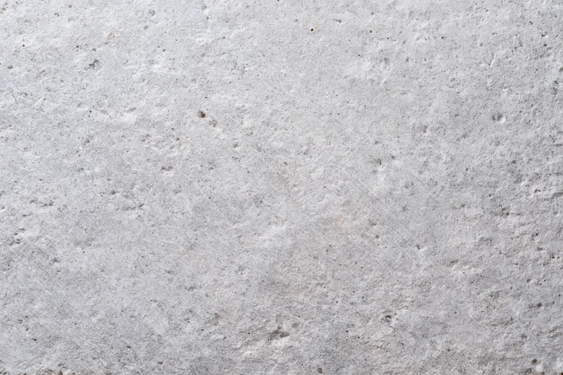 Close-up of a rough gray concrete wall surface filling the frame