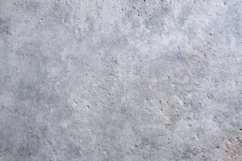 Close-up of a rough gray concrete wall surface filling the frame