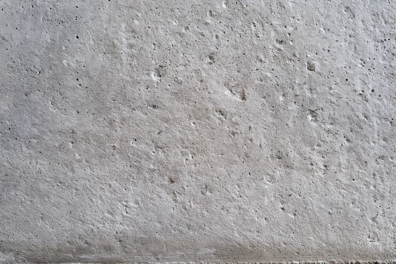 Close-up of a rough gray concrete wall surface
