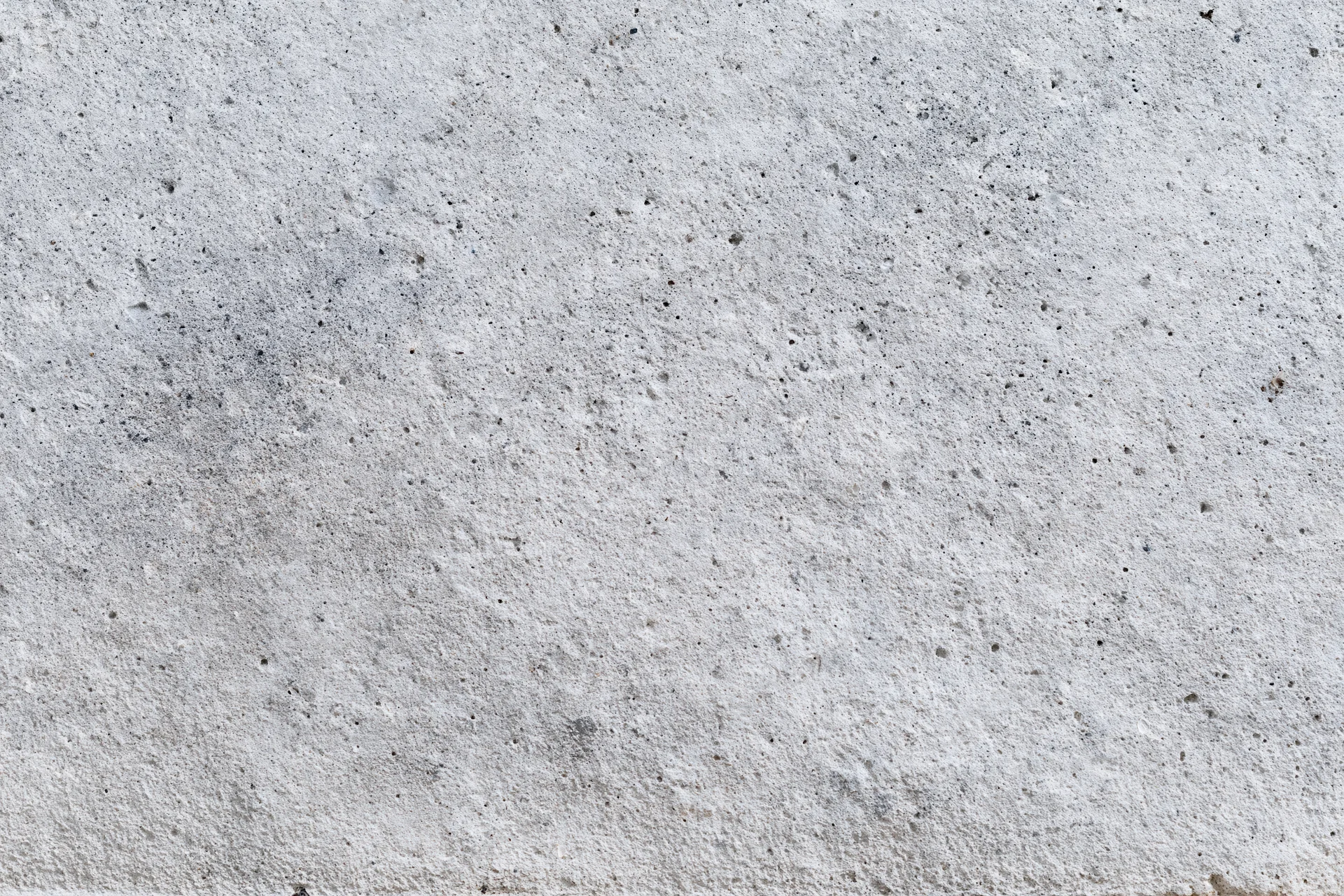 Close-up of a rough gray concrete surface filling the frame