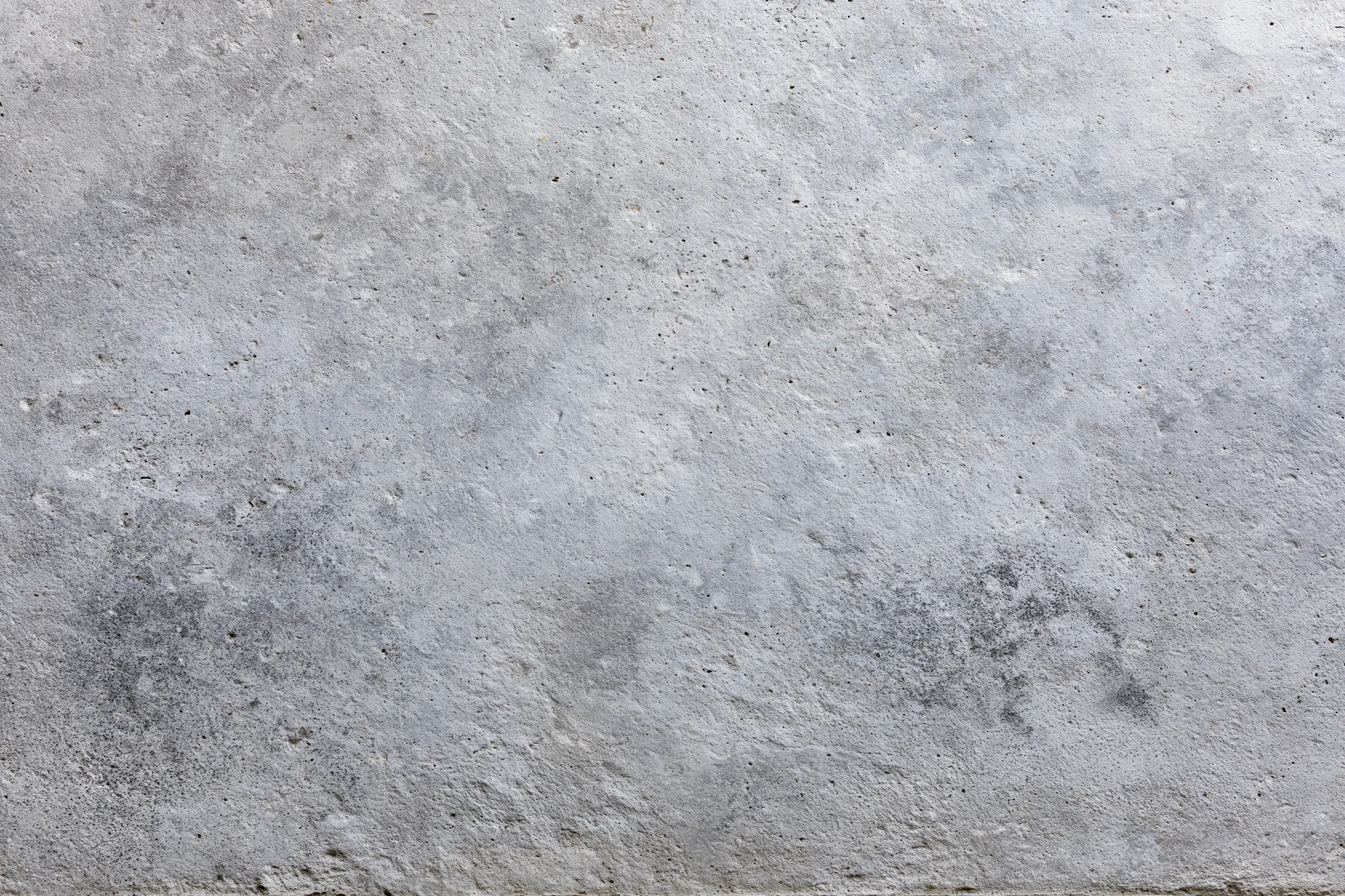 Close-up of a weathered concrete wall surface filling the frame