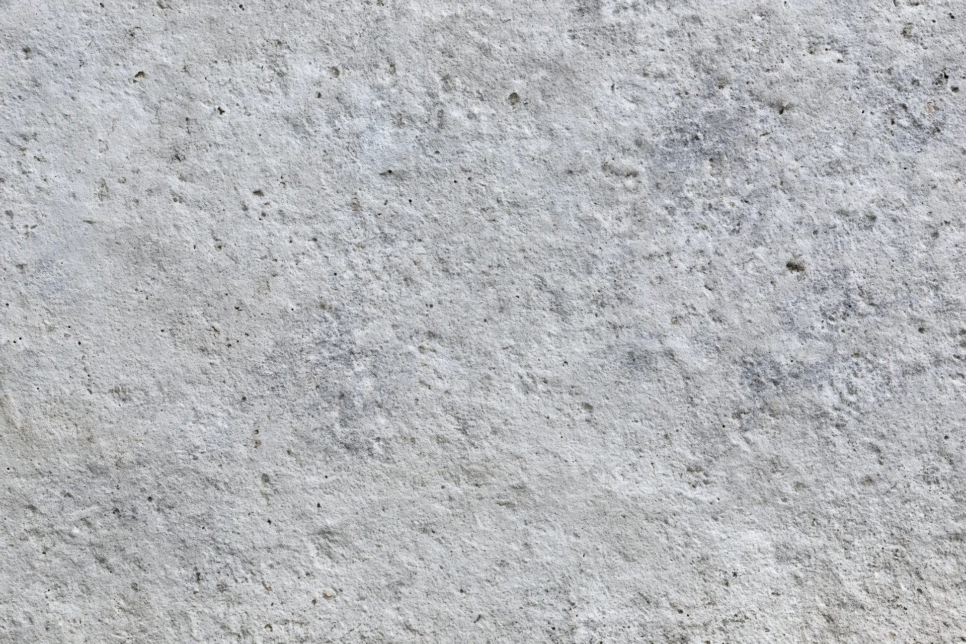 Close-up of a rough gray concrete surface filling the frame