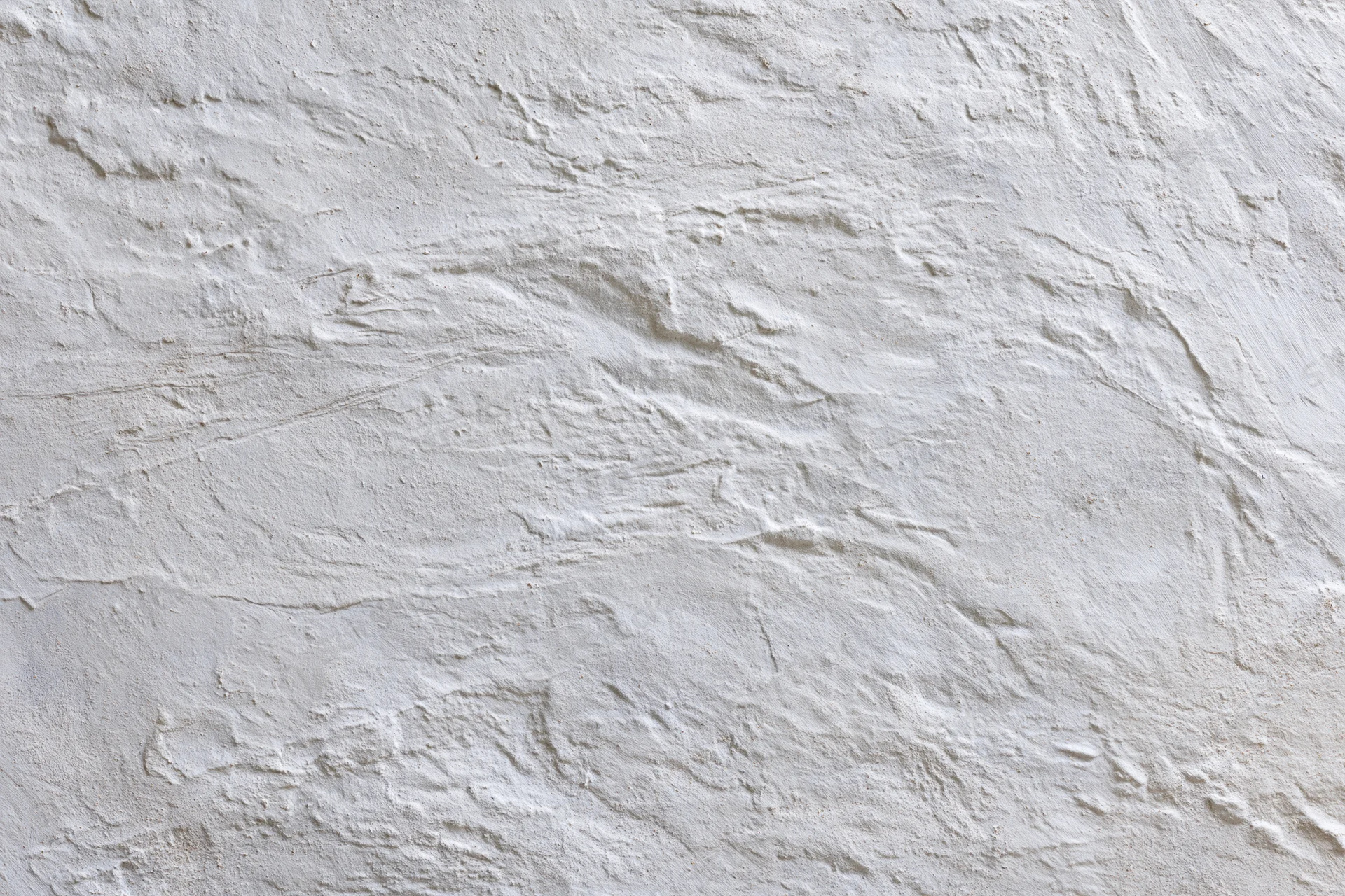 Close-up of textured white concrete wall surface