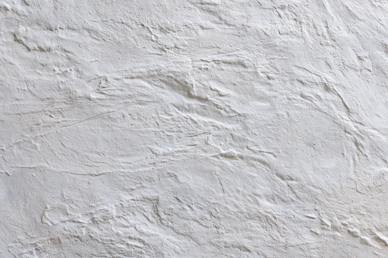 Close-up of textured white concrete wall surface