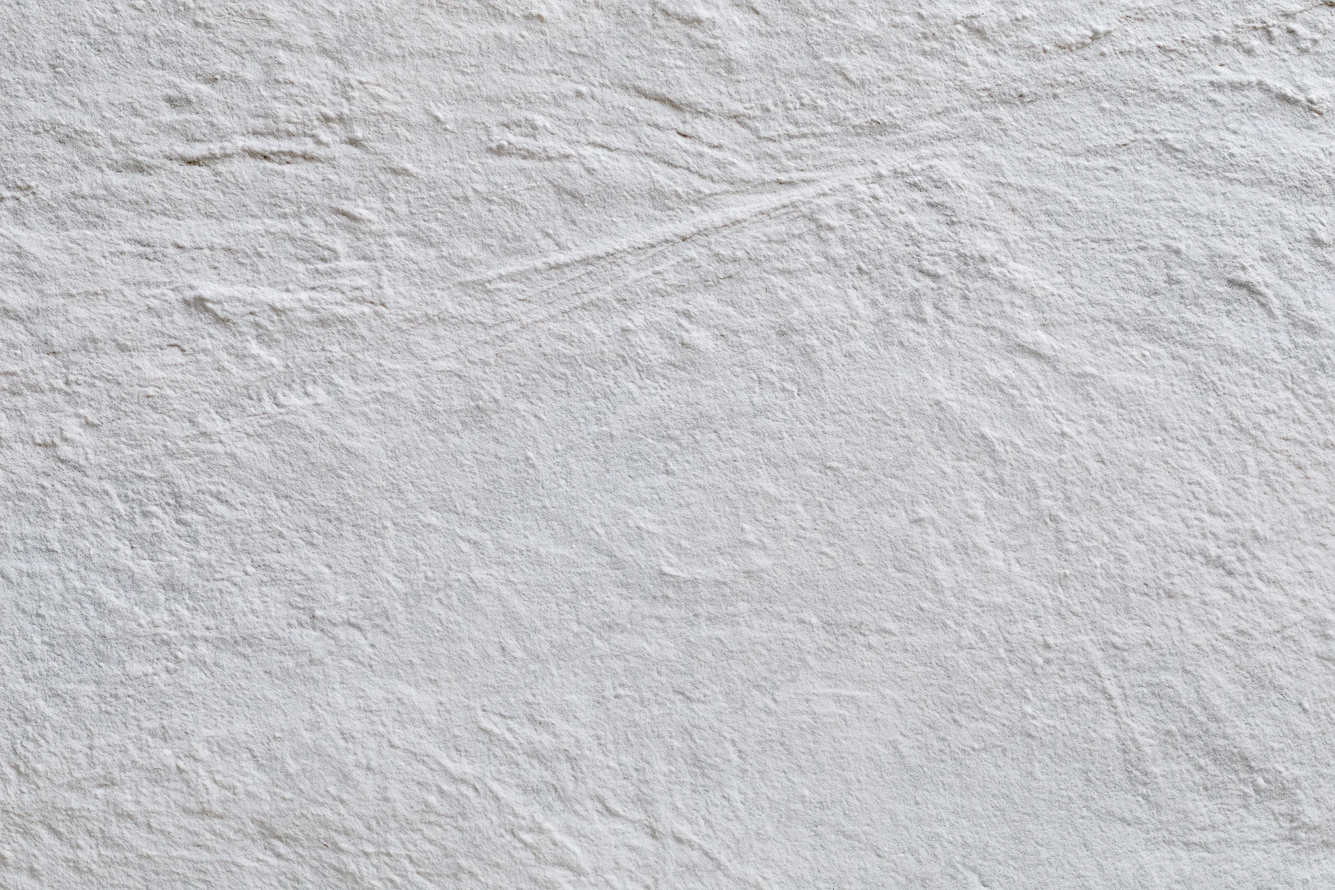 Close-up of a textured concrete wall surface filling the frame