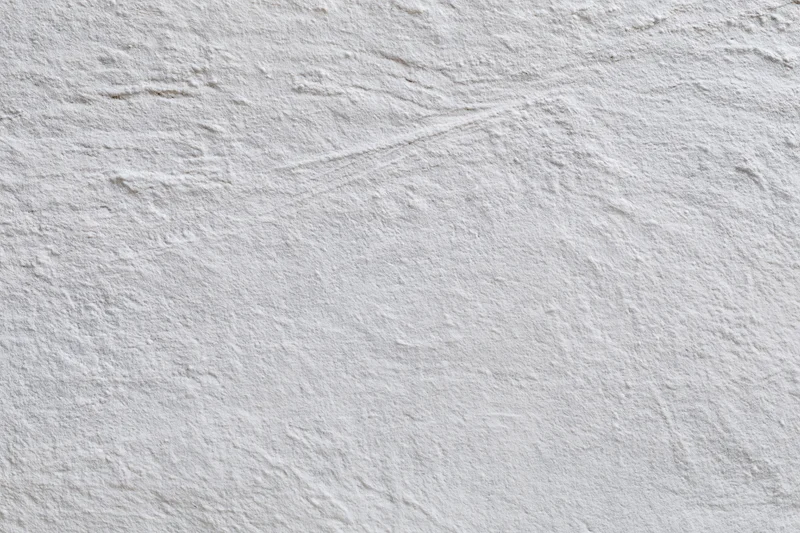 Close-up of a textured concrete wall surface filling the frame