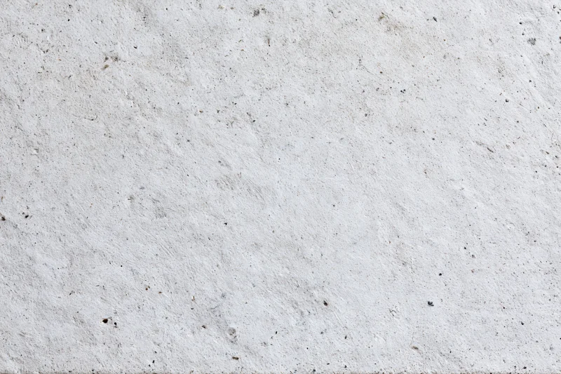 Close-up of a rough gray concrete wall surface filling the frame