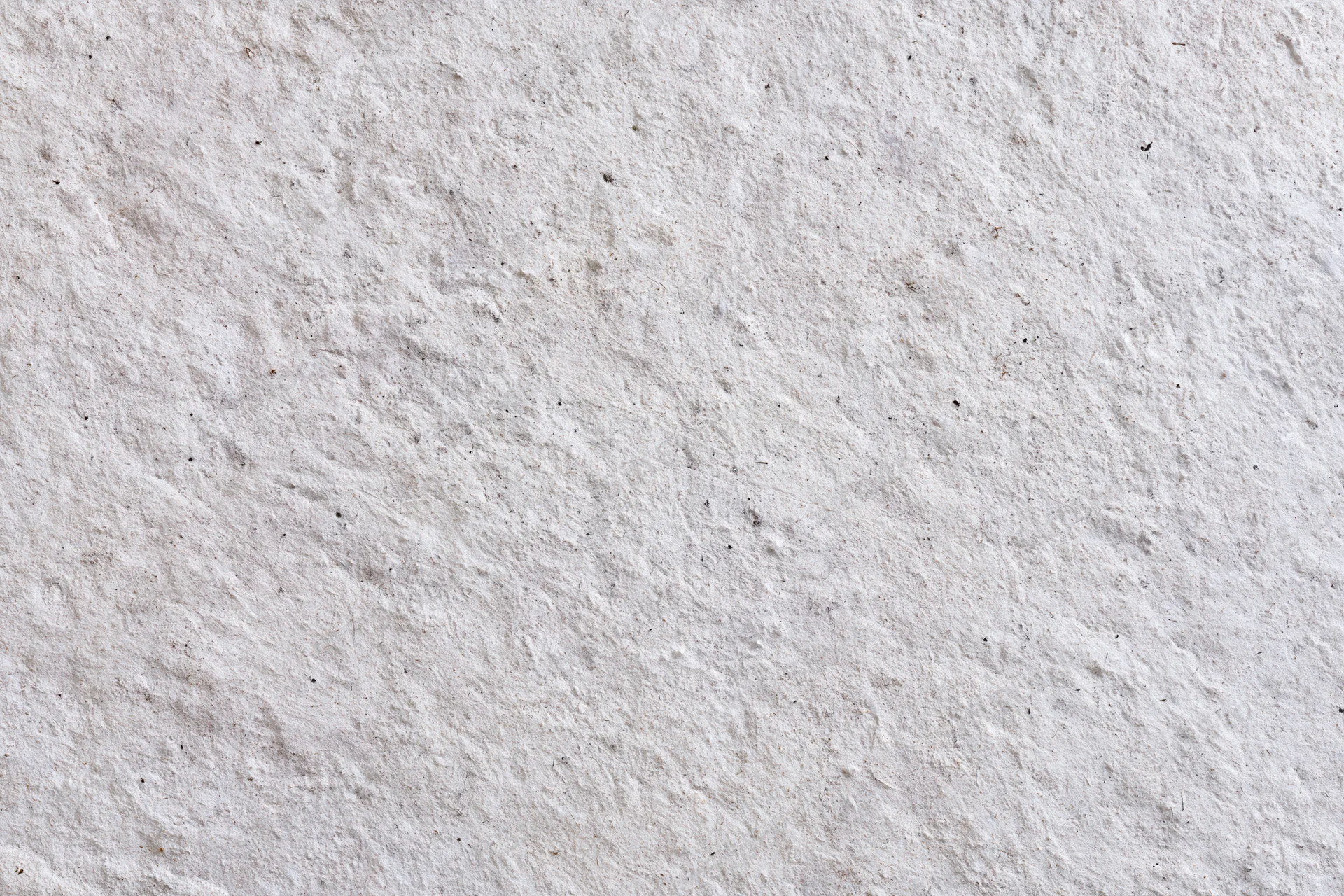 Close-up of rough concrete wall surface filling the frame