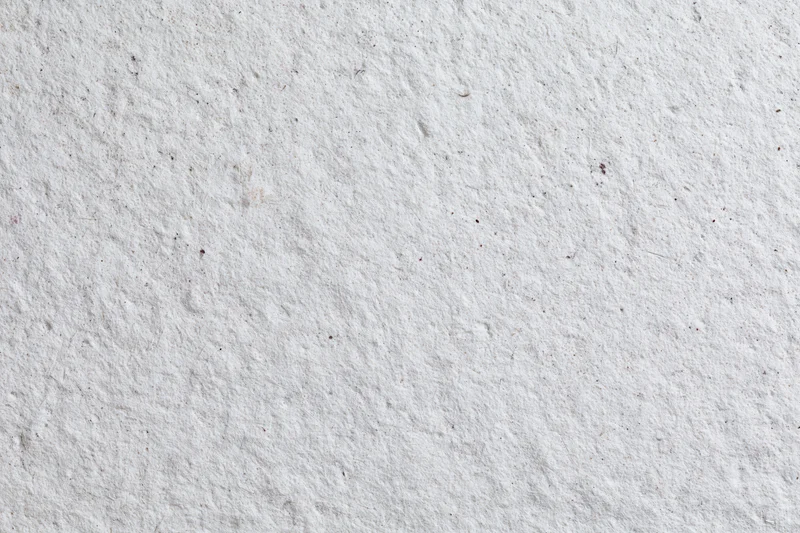 Close-up of a textured concrete wall surface filling the frame