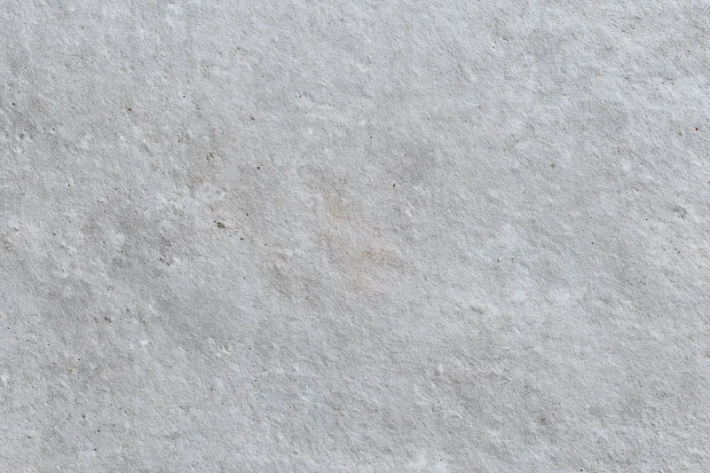 Close-up of a rough gray concrete wall surface filling the frame