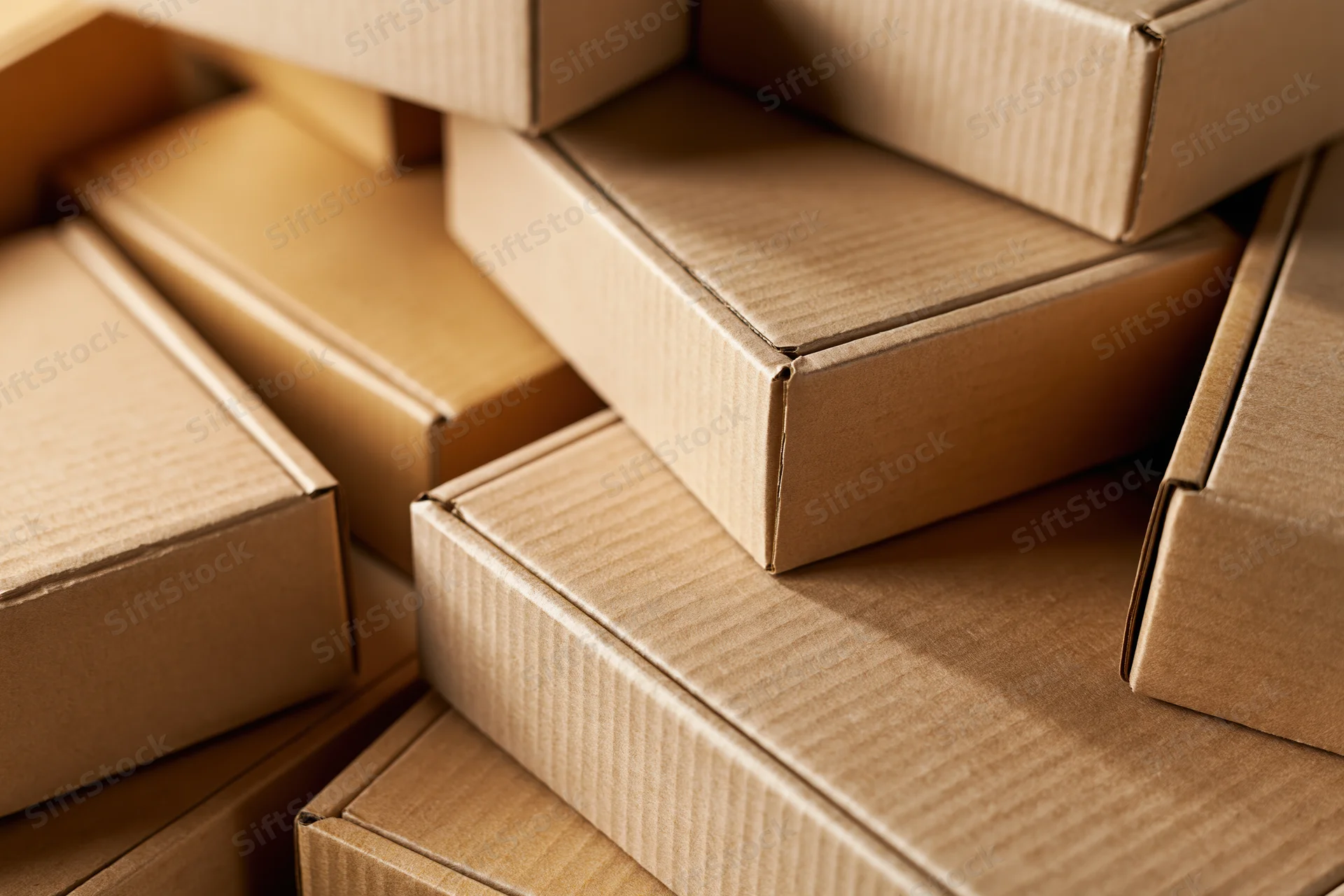 Stacked cardboard boxes arranged in a pile for shipping and storage