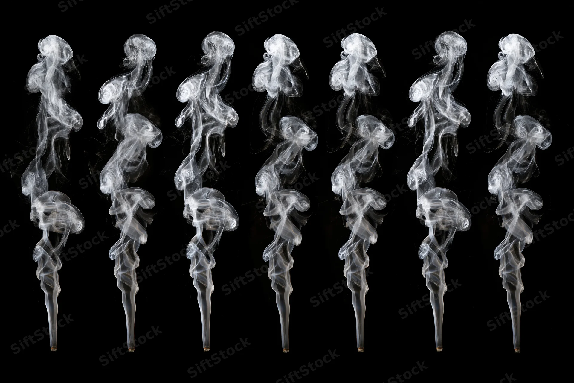 White smoke plumes arranged in a grid against black background
