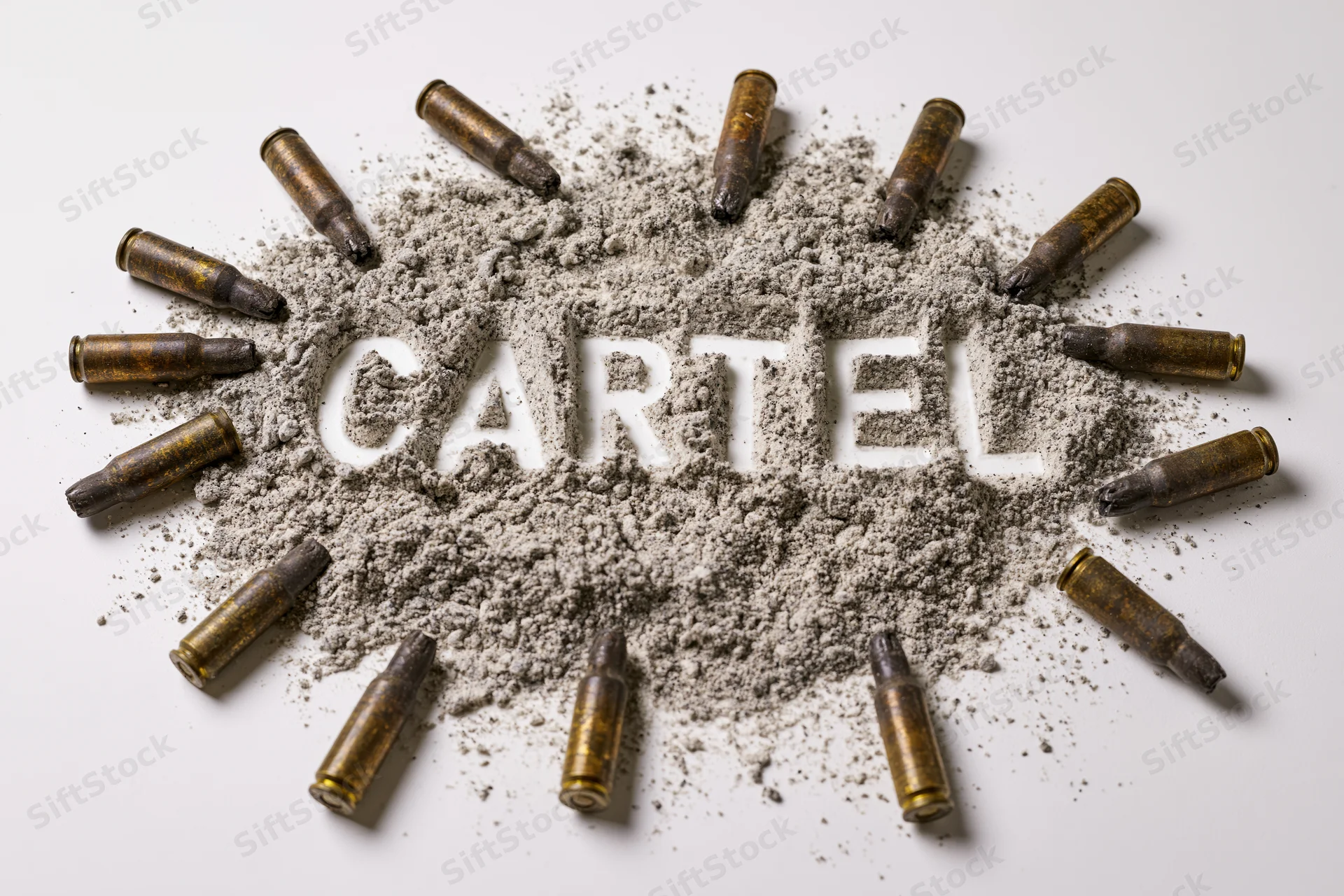 The word cartel spelled in powder surrounded by bullets on white background