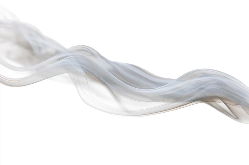 Thin wisp of white smoke curling and rising against a plain white background