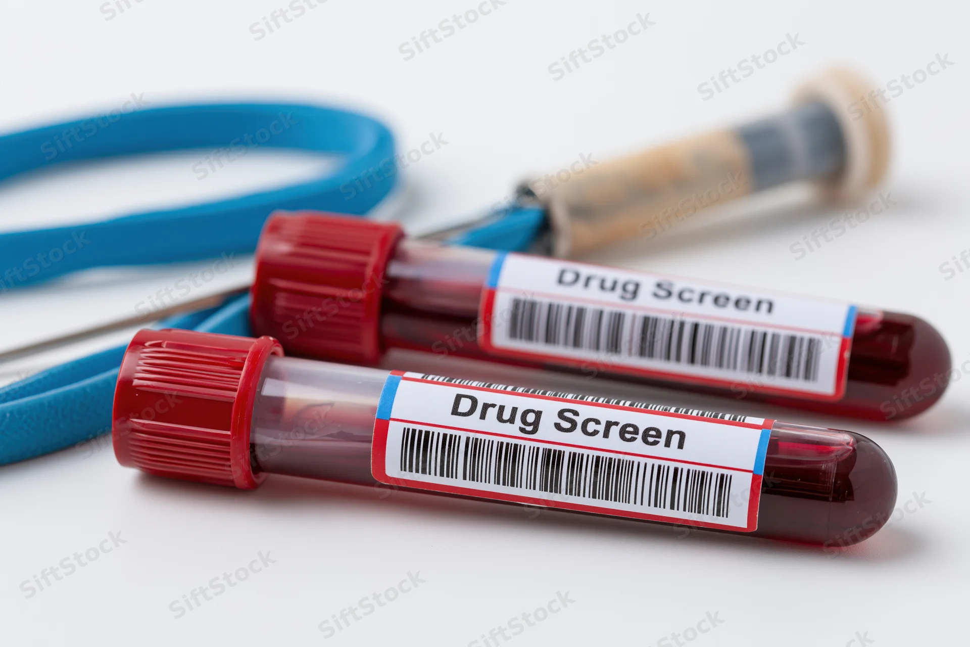 Two blood vials labeled drug screen with syringe and tourniquet on white background